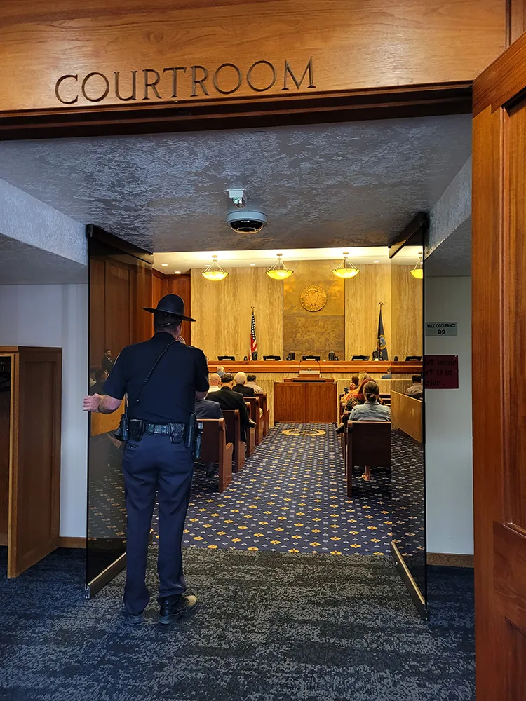 Idaho Supreme Court courtroom with a security officer standing out front